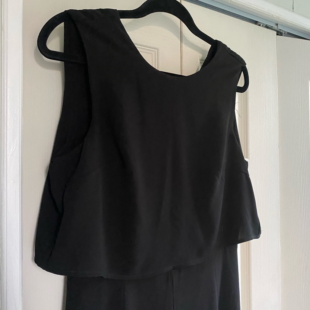 Black jumpsuit no tags but never worn. Ankle length.
